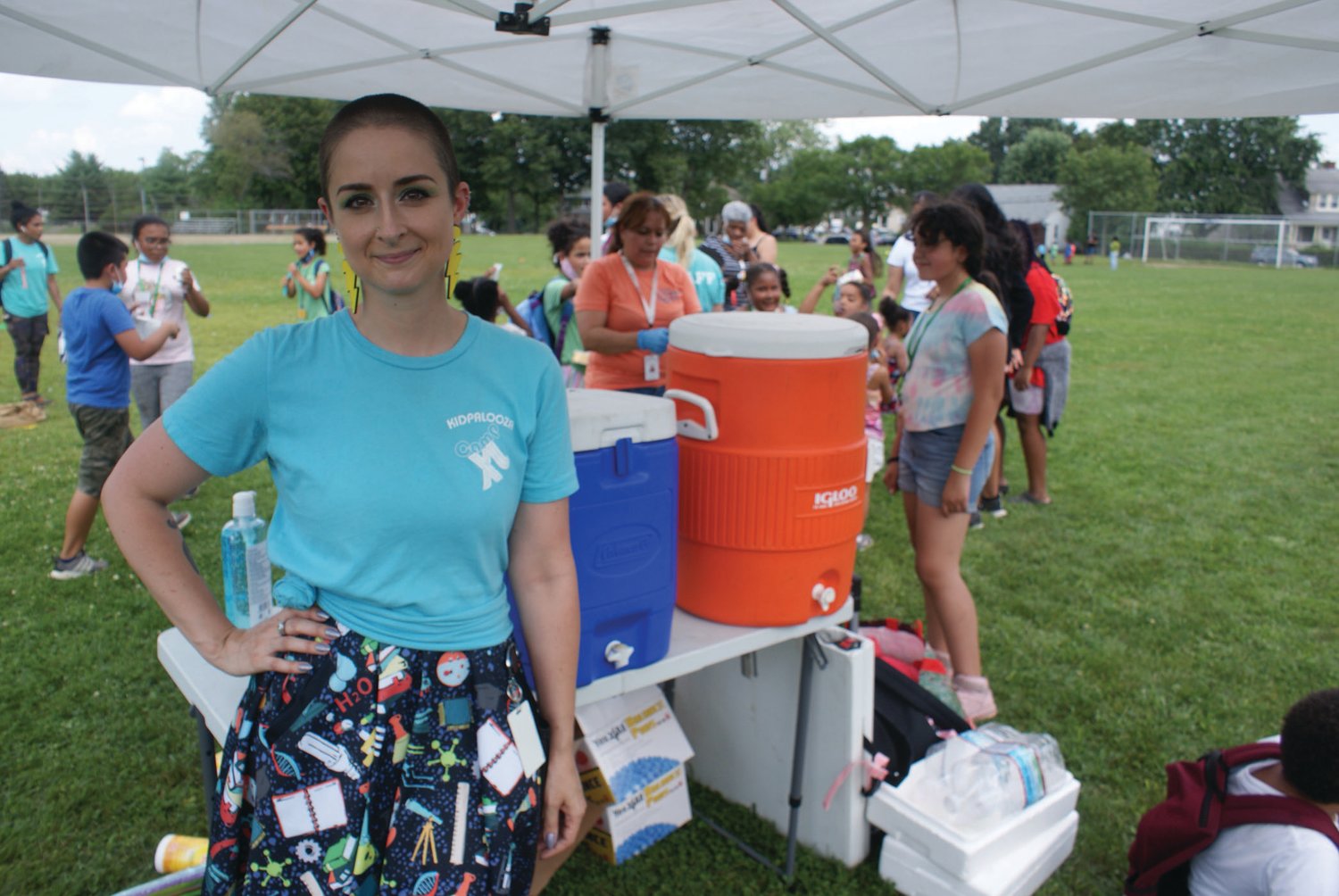 RUNNING THE SHOW: Pictured is Sarah DeCosta, program director for Camp XL, at Bain Middle School’s Tate Field during Kidpalooza last week. 